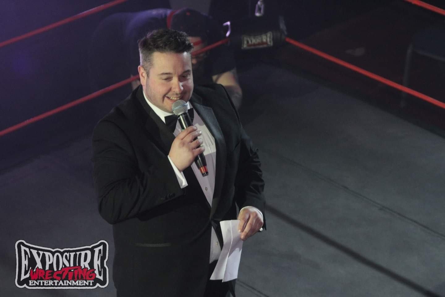 Jonathan Millard announcing at Exposure Wrestling Entertainment ringside