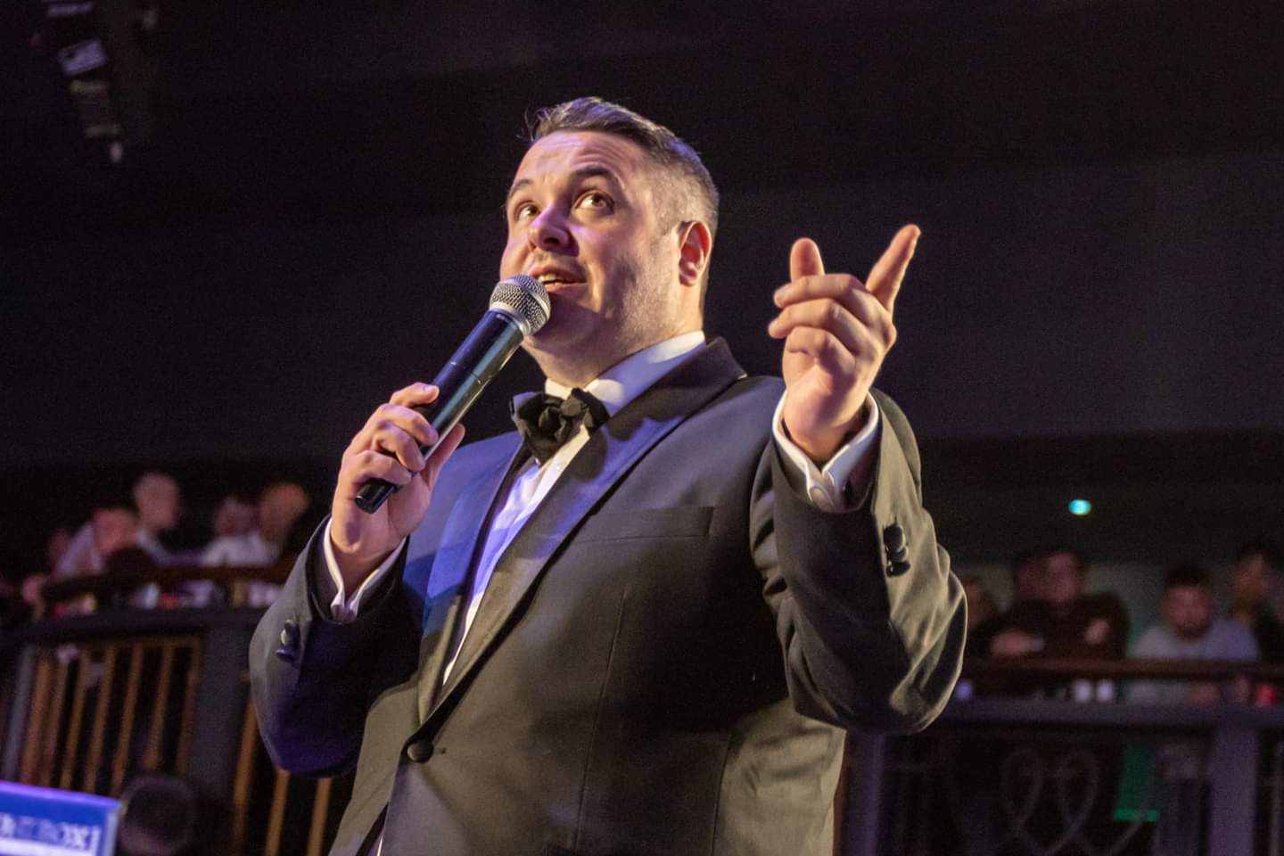 Jonathan Millard commanding the ring at a professional boxing event